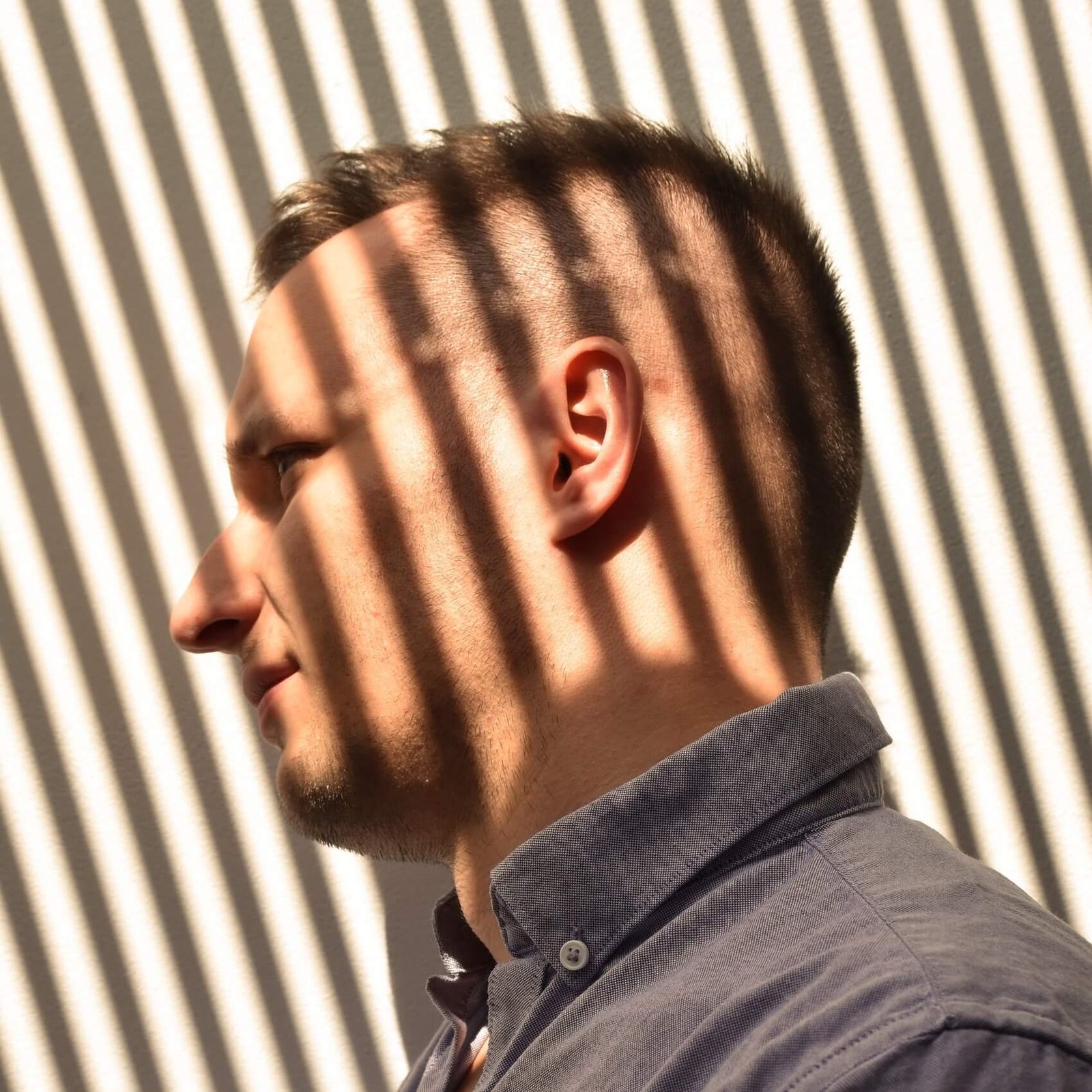 portrait-of-young-man-s-face-with-play-of-light-an-2026-03-20-05-54-36-utc
